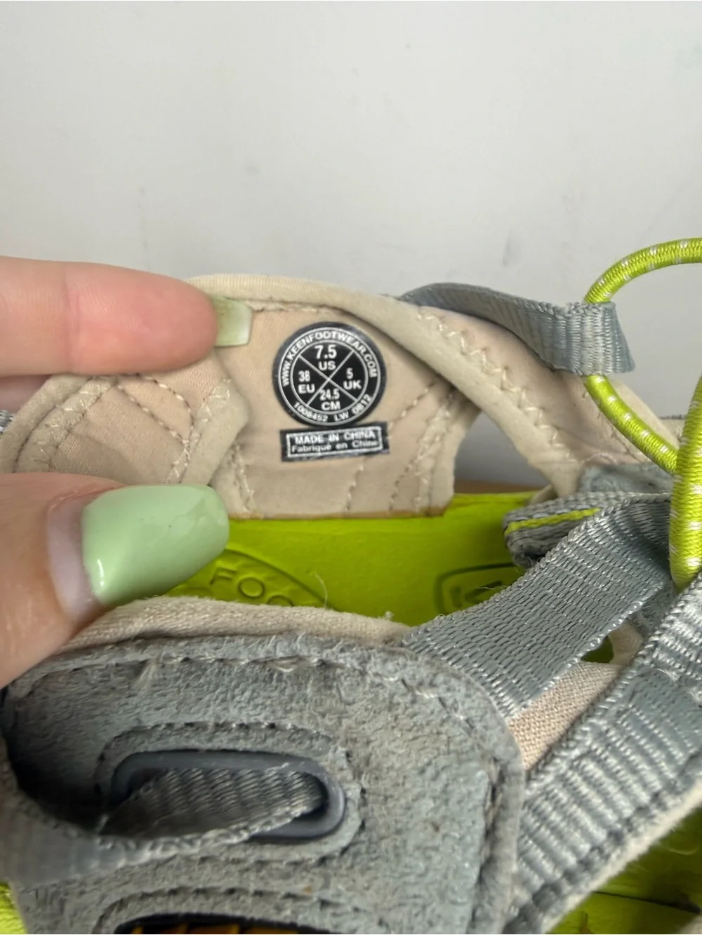 women's Keen Whisper sandals in a neutral gray and bright green colorway